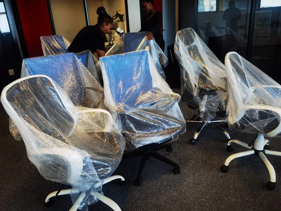 Titan Logistix professional home and office removal team packing furniture