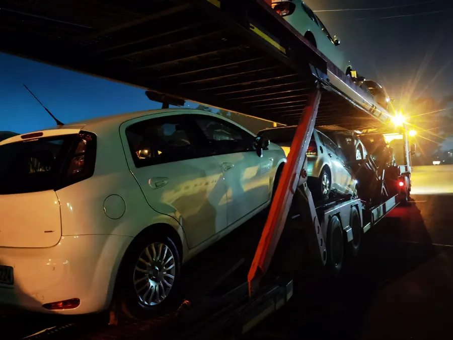 Titan Logistix auto transport carrier loaded with multiple vehicles for nationwide delivery