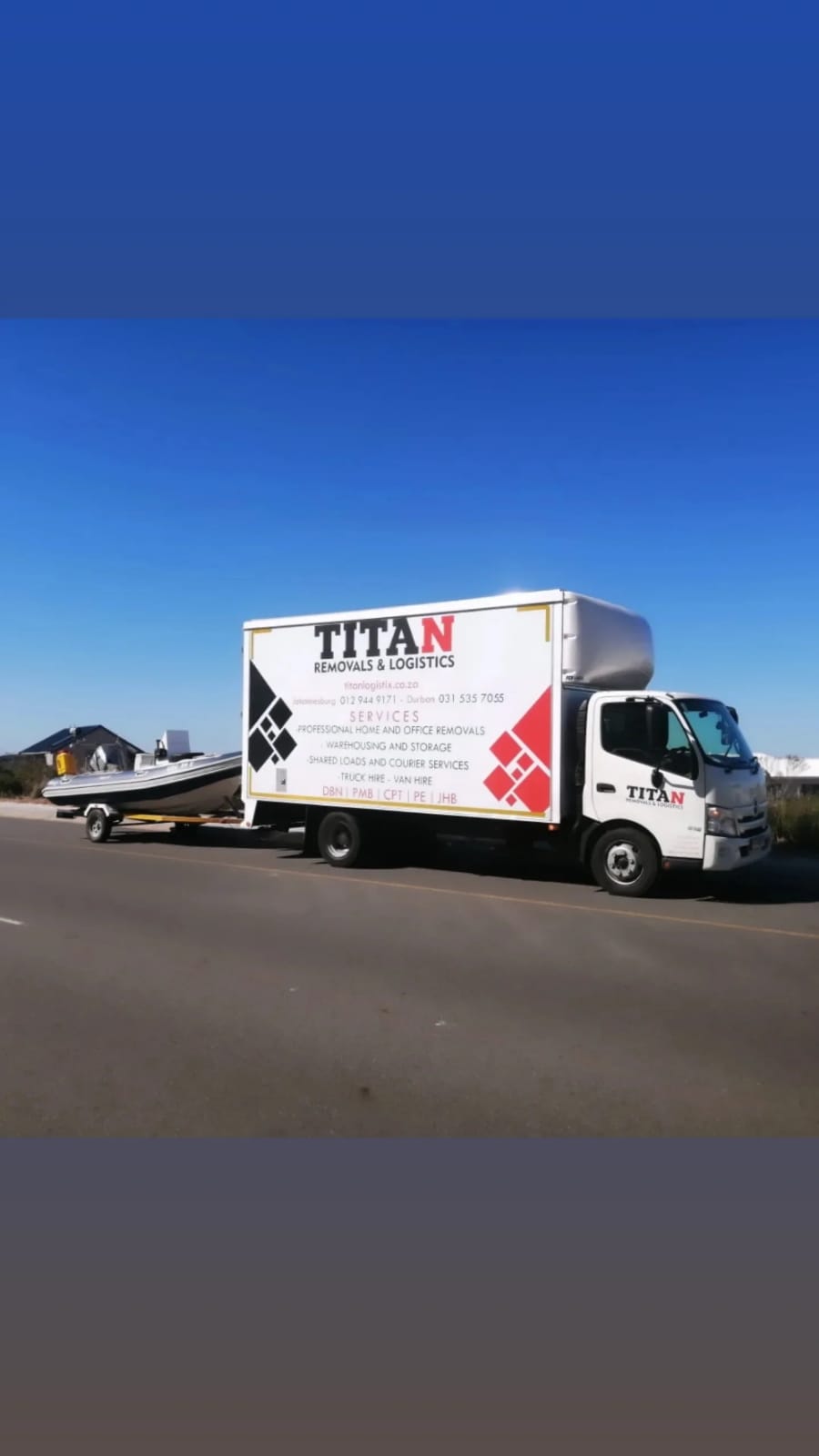 Titan Logistix truck pulling boat
